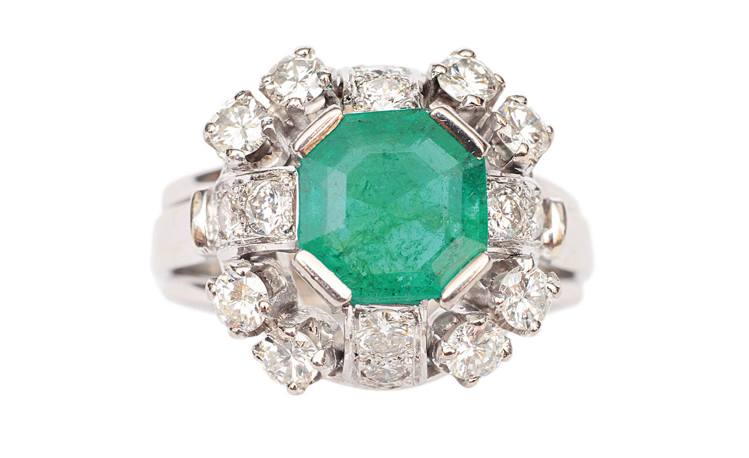 An emerald diamond ring