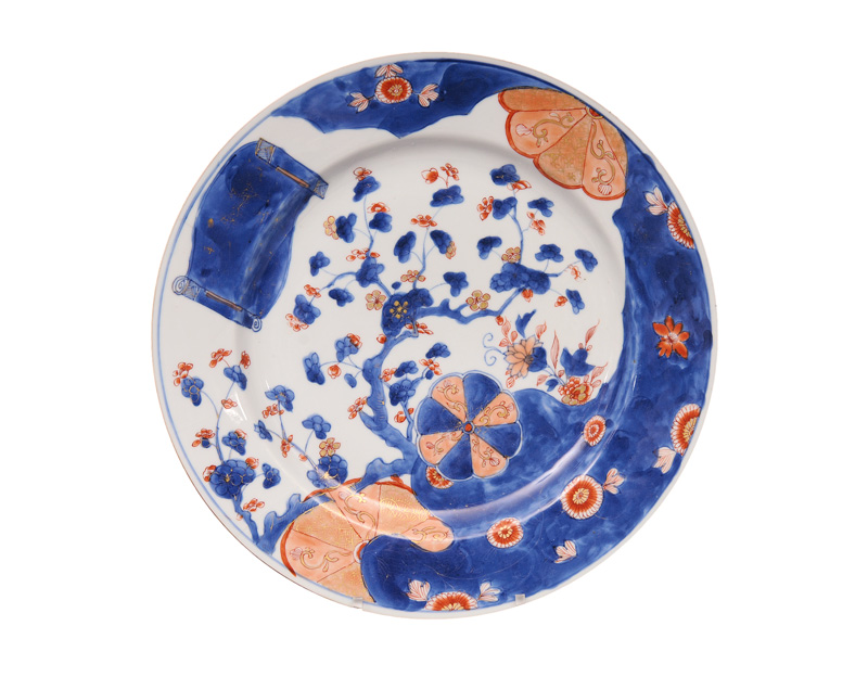 A large circular Imari plate with plum blossoms