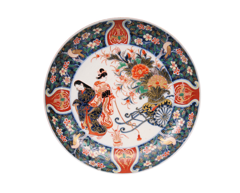 A large Imari plate with ladies