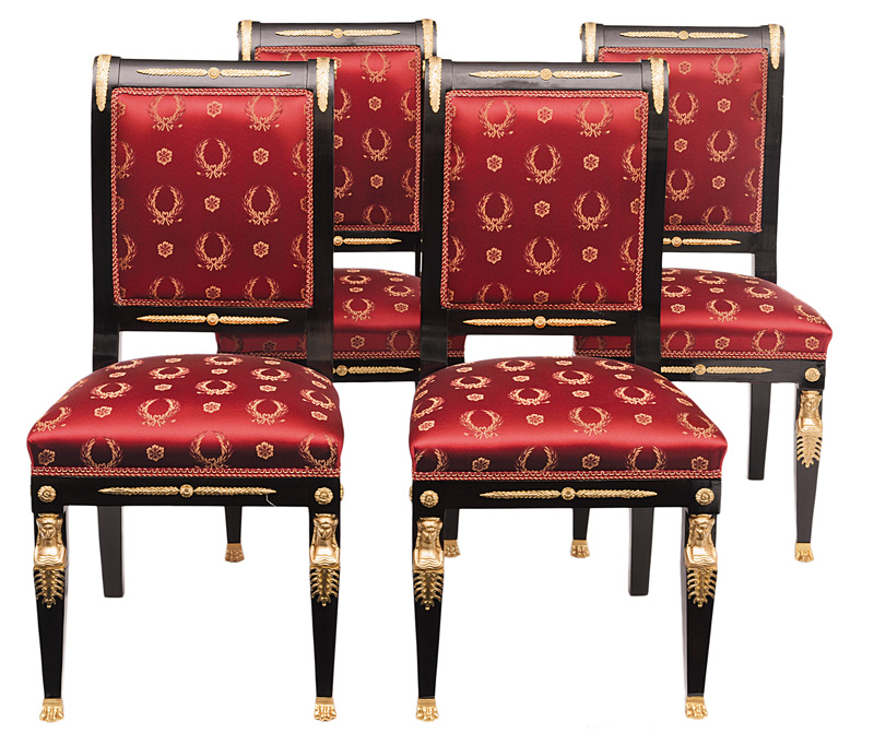 A set of four ebonised chairs in the style of Empire