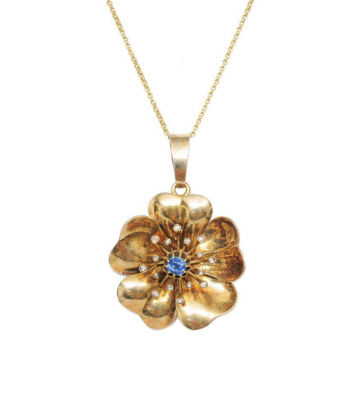 A flowershaped pendant with necklace
