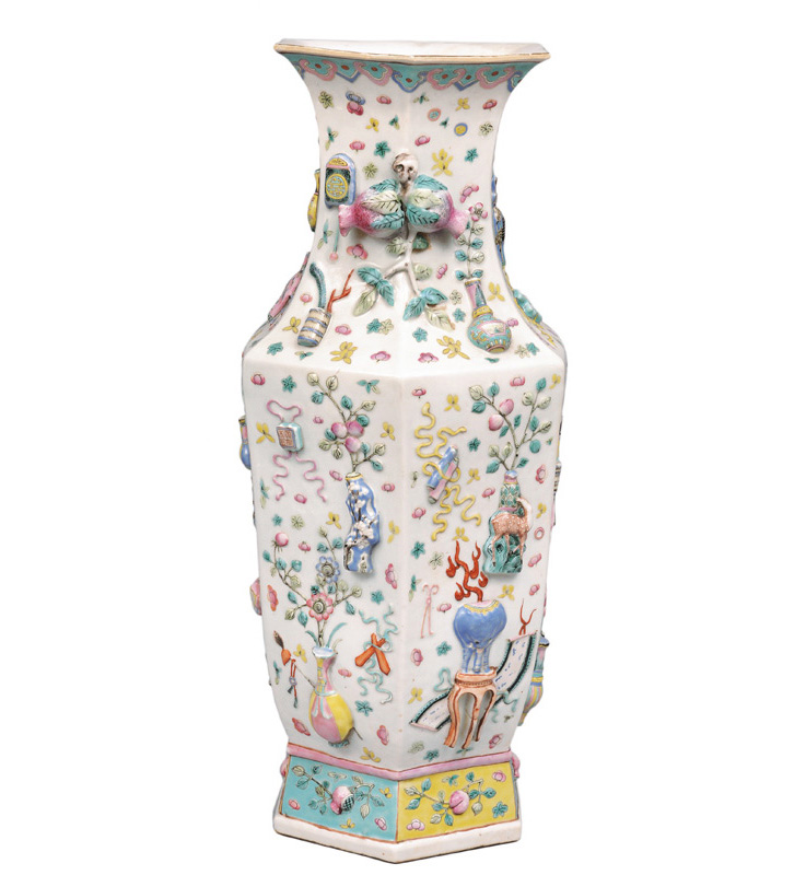 A tall hexagonal vase with relief decoration "100 Antiquities"