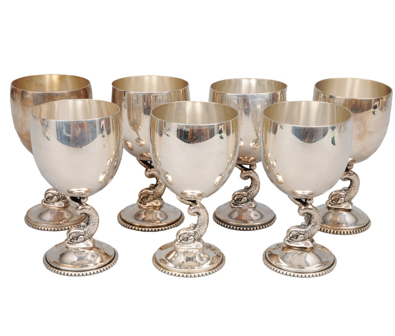 A set of seven foot cups with delphin