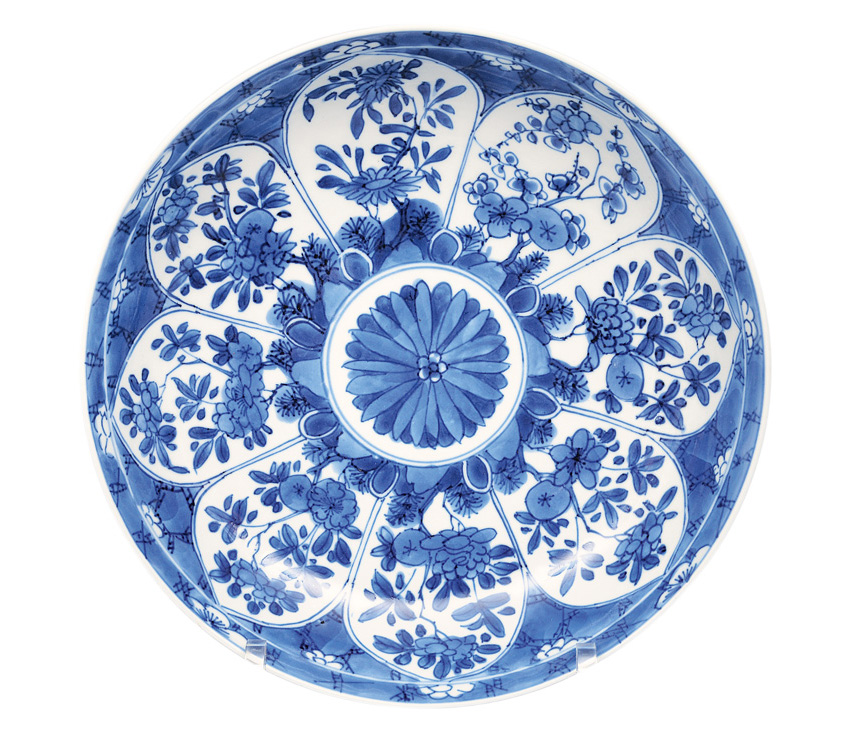 A bowl with radial decoration of flowers and fruits