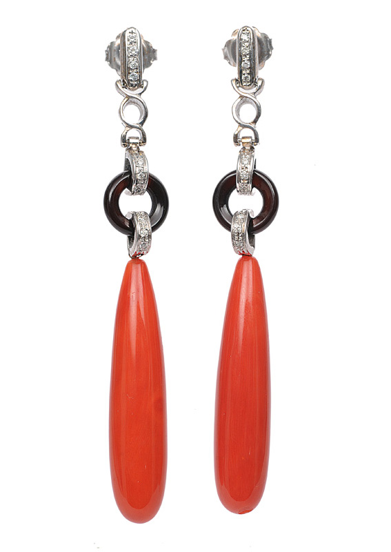 A pair of coral onyx earpendants in the style of Art-déco A pair of coral onyx earpendants in the style of Art-déco