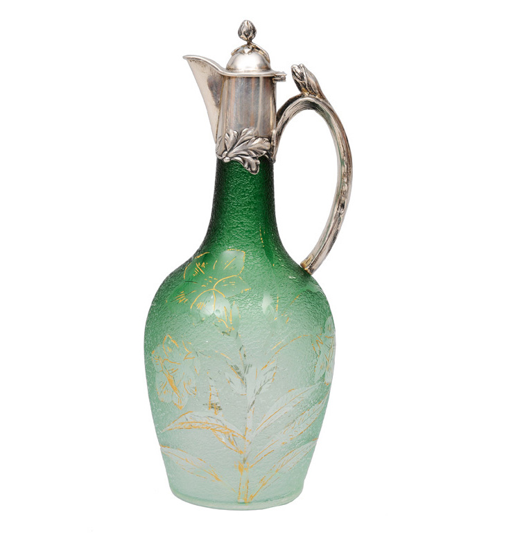 An Art Nouveau glass jug with silver mounting
