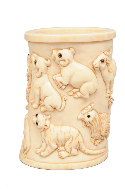 An ivory brushpot with zodiacs