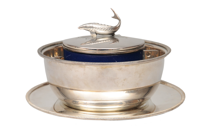 A caviar bowl with fish decoration