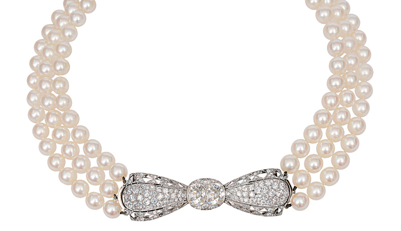 A pearl necklace with antique diamond clasp