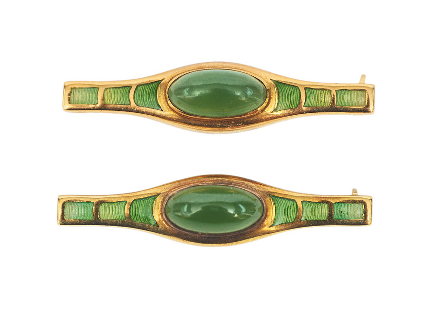 A pair of brooches with beryl and enamel