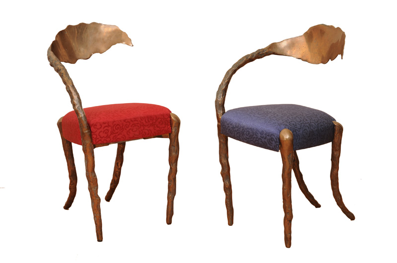 A pair of sculptural bronze chairs