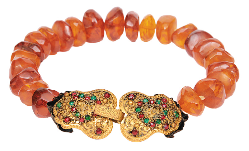 An antique amber necklace with traditional clasp
