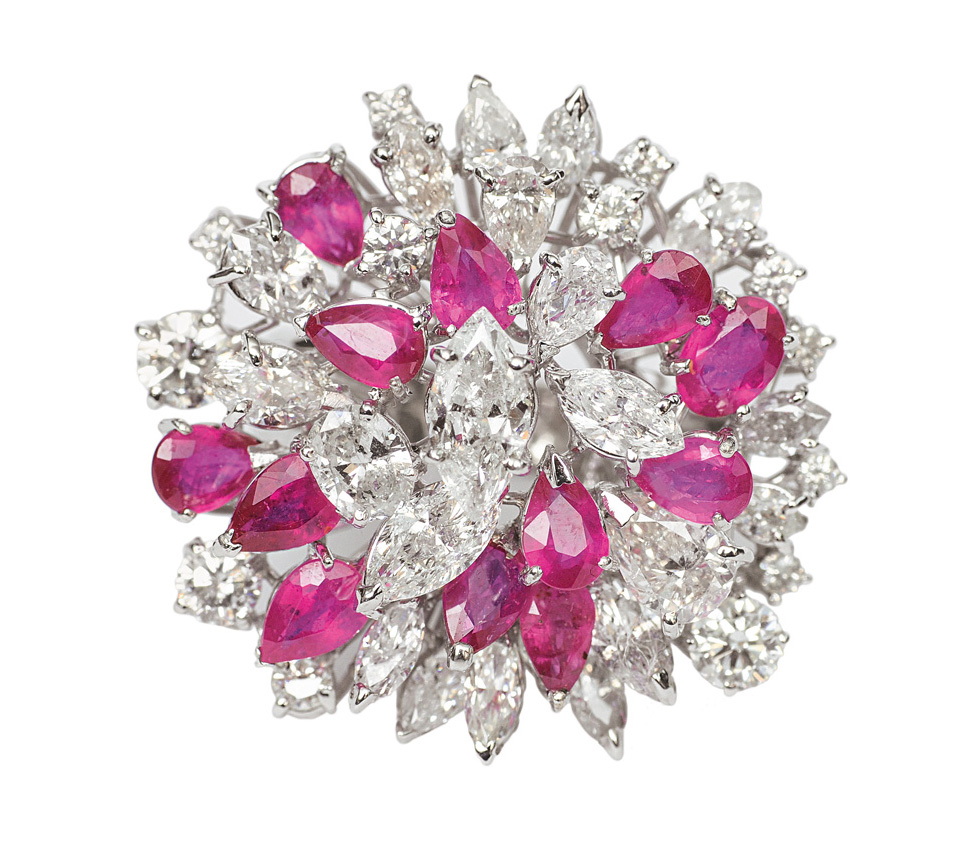A flowershaped ruby diamond cocktailring