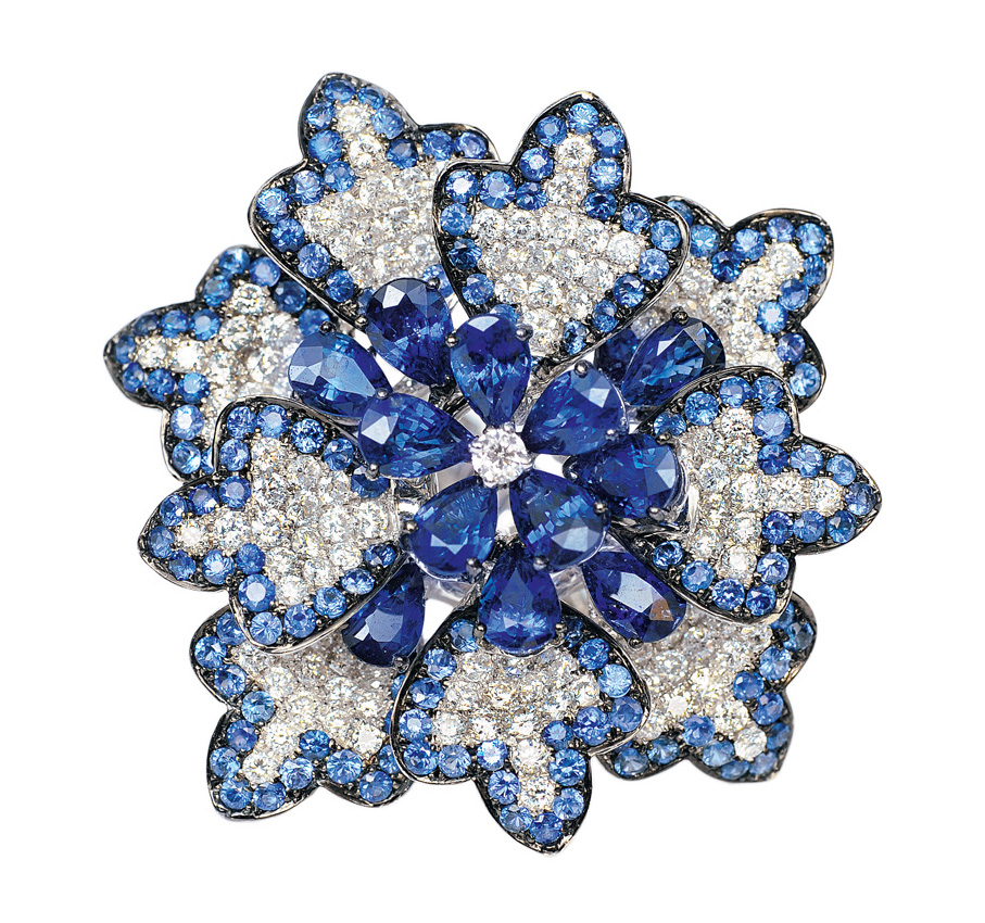 A large flowershaped cocktail ring with sapphires and diamonds