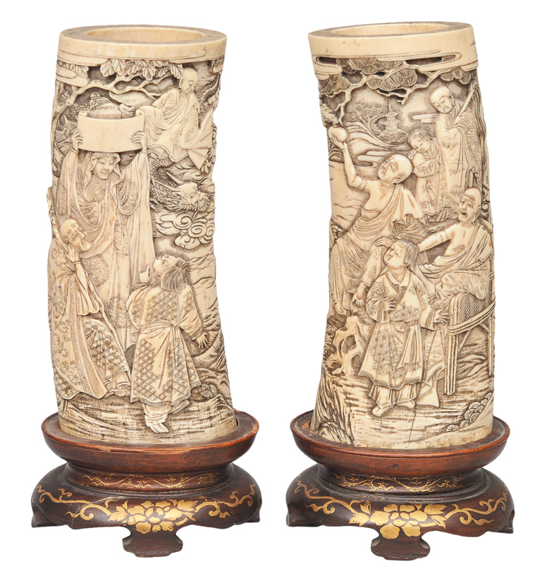 A pair of fine ivory brushpots with mythological scenes