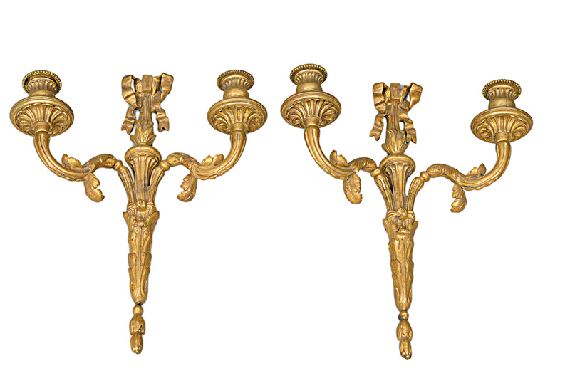A pair of decorative wall candleholders