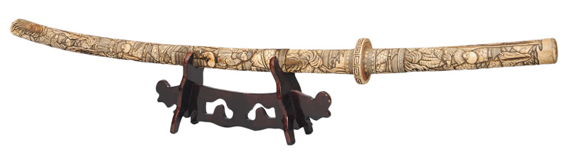 A bone mounted Katana with figural relief scenes
