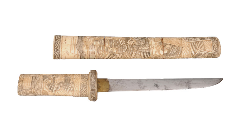 A bone-mounted Aikuchi with figural relief scenes