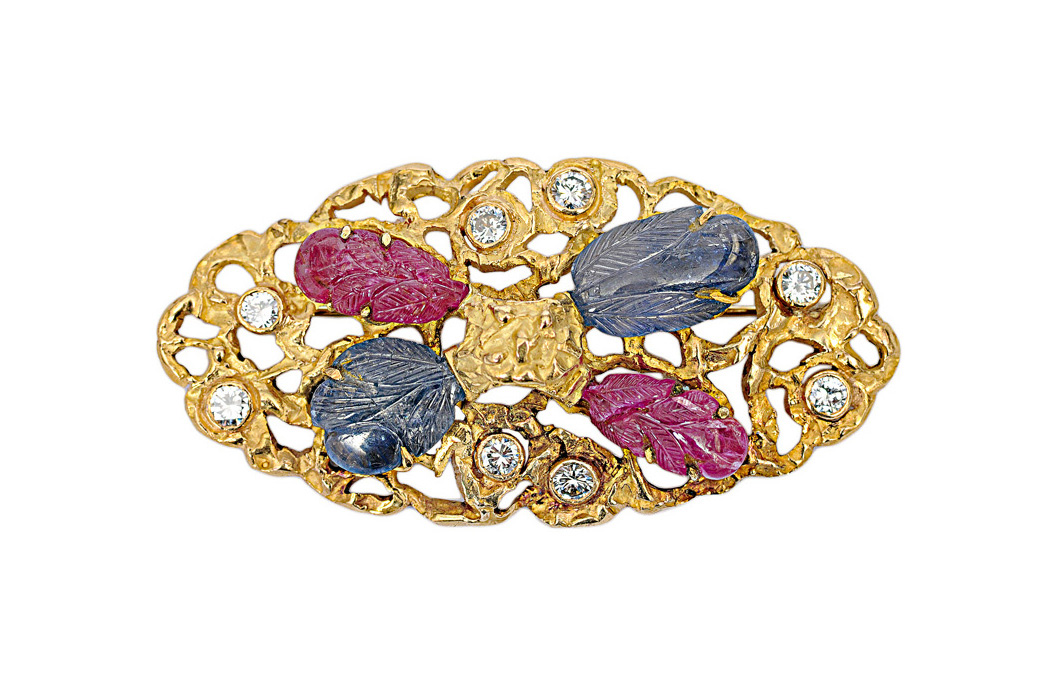 A modern sapphire ruby brooch with diamonds