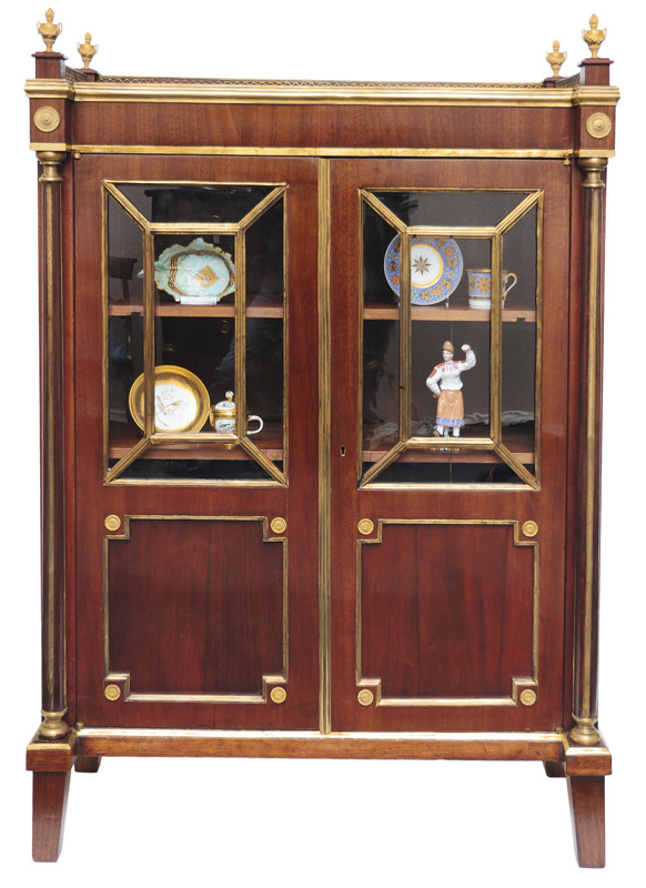 An elegant Empire glass cabinet