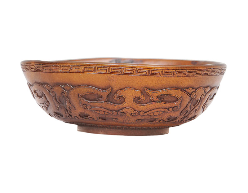 A fine Rhinoceros horn bowl with Taotie-masks