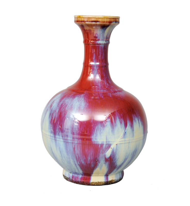 A tall flambé-glazed bottle vase