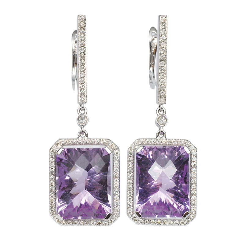 A pair of amethyst diamond earrings
