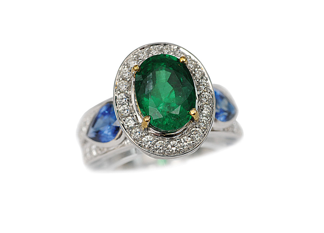 An emerald sapphire diamond ring