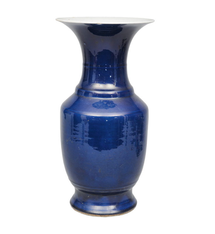A bright blue baluster vase with trumpet neck