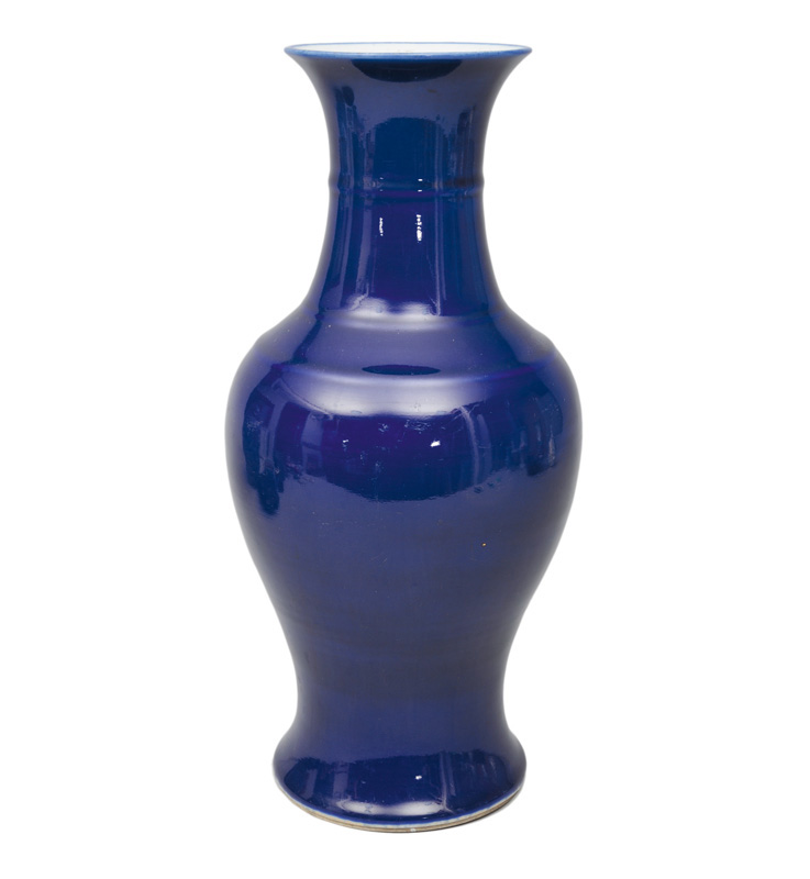 A bright blue baluster vase