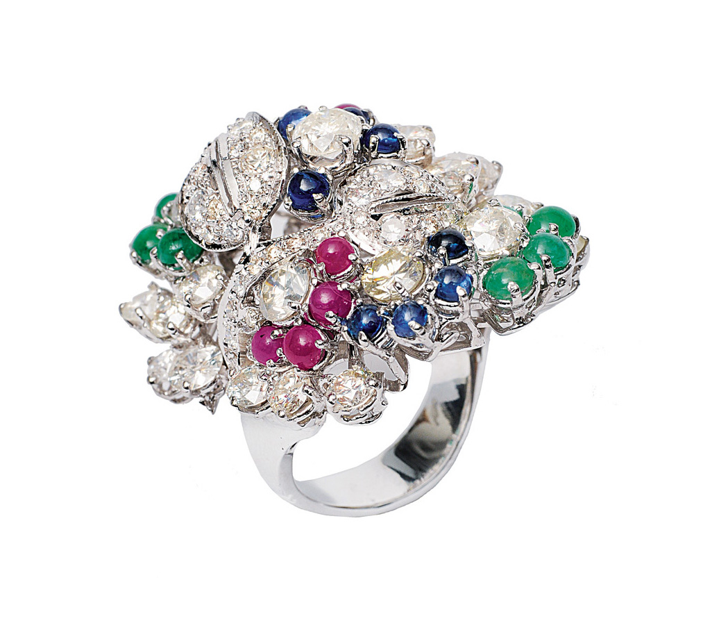 A highcarat diamond ring with emeralds, rubies and sapphires