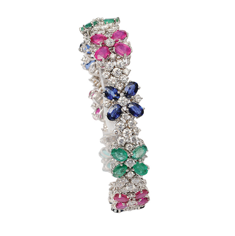 A colourful bracelet with diamonds, sapphires, rubies and emeralds