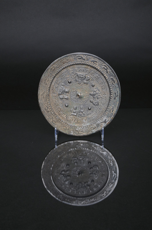 A bronze mirror with deities and mythical creatures - image 3
