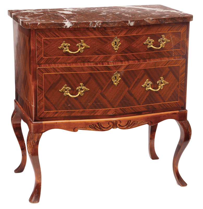 A small chest of drawers in the style of Baroque
