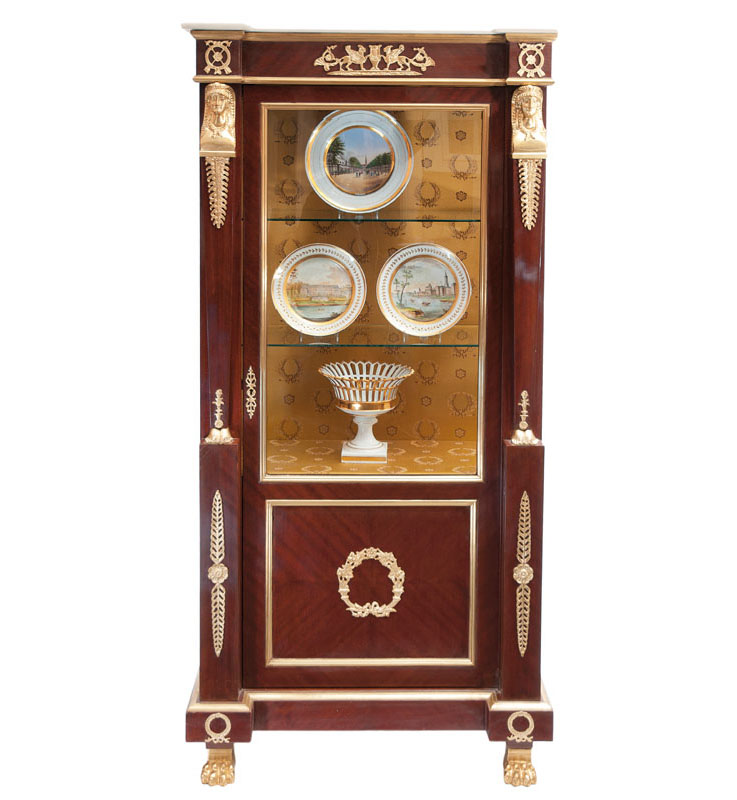 A glass cabinet in Empire style
