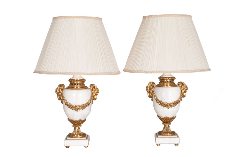 A pair of marble vase lamps with empire ornaments