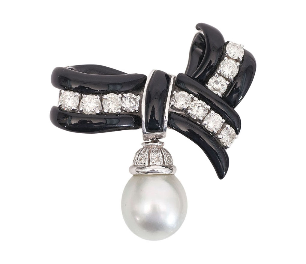 A Southsea pearl diamond brooch with onyx bow