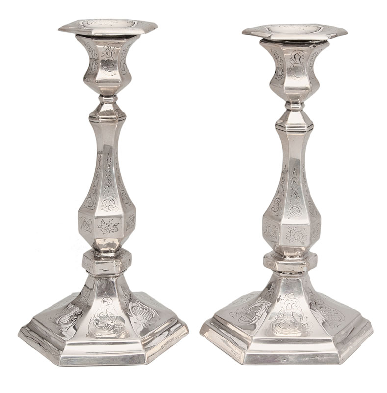 A pair of candelabra with fine engraved Baroque decoration