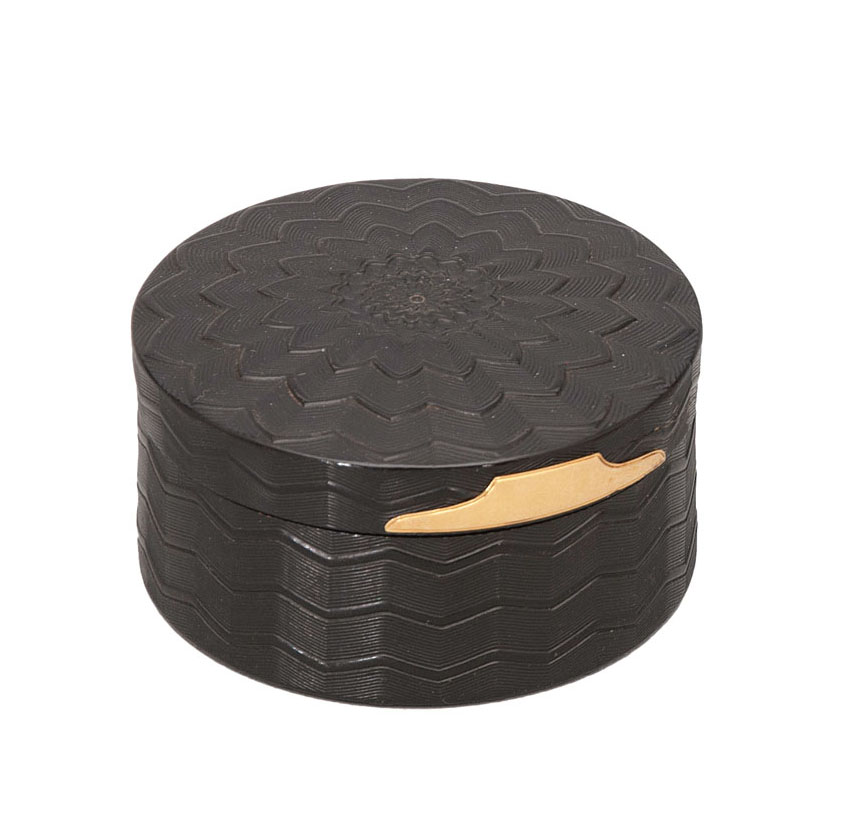A round tortoiseshell box