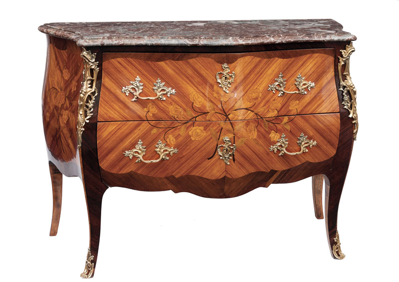 A opulent chest of drawers in the Louis Quinze style