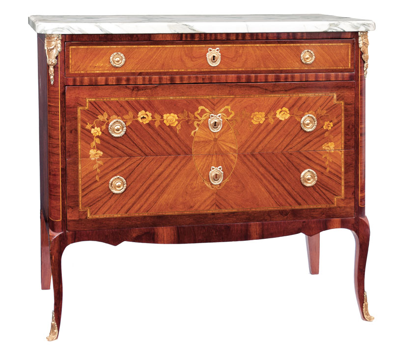 An elegant chest of drawers with floral marquetry