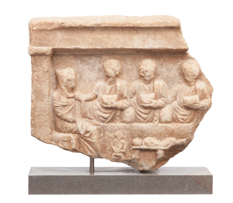 A roman fragment of an antique votive relief 'Familiy meal'