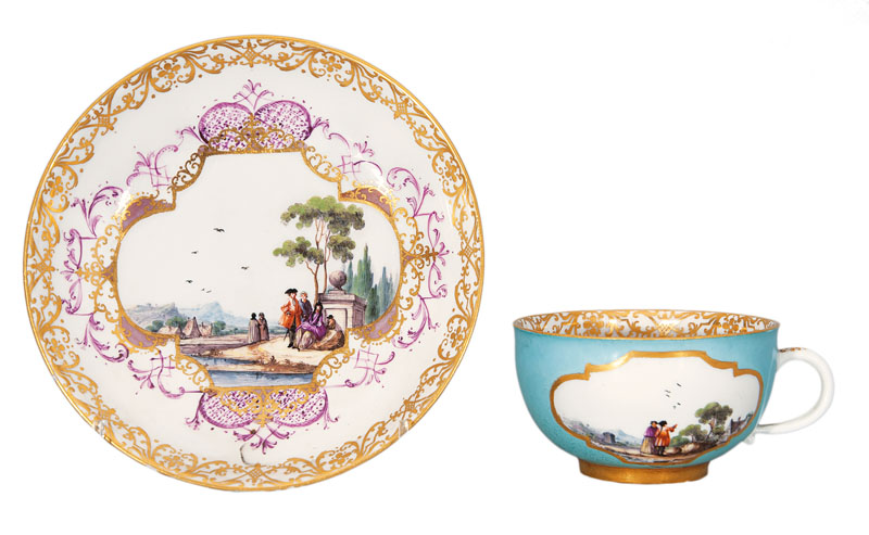 A yellow-ground cup and saucer with Kauffahrtei- and landscape scenes