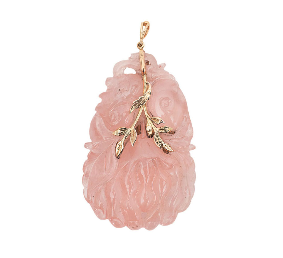 A large pendant with fine carved rosequartz