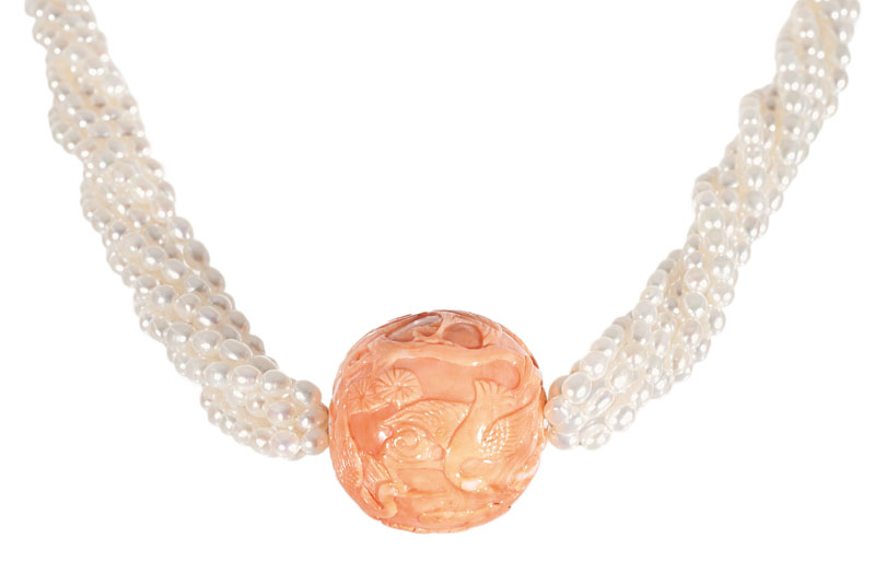 An antique coral with chinese carving on pearl necklace