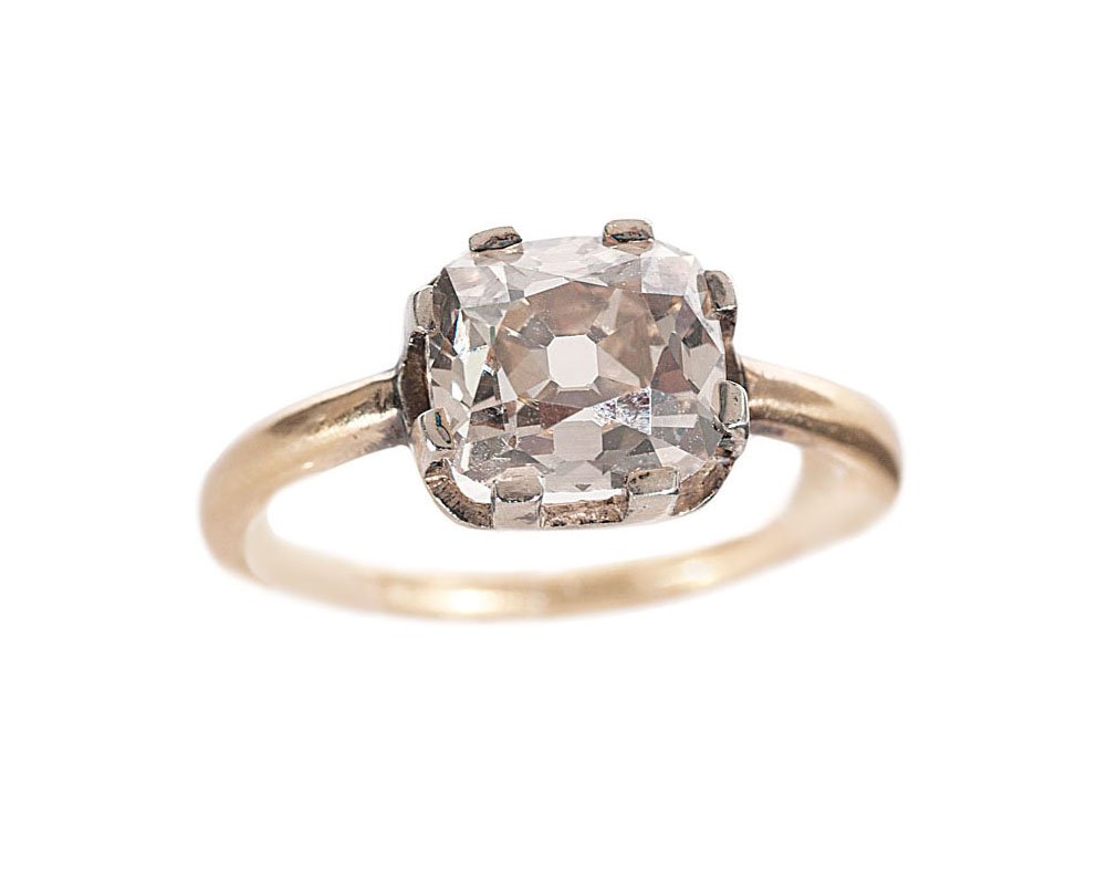 An Art-Nouveau solitaire diamond ring