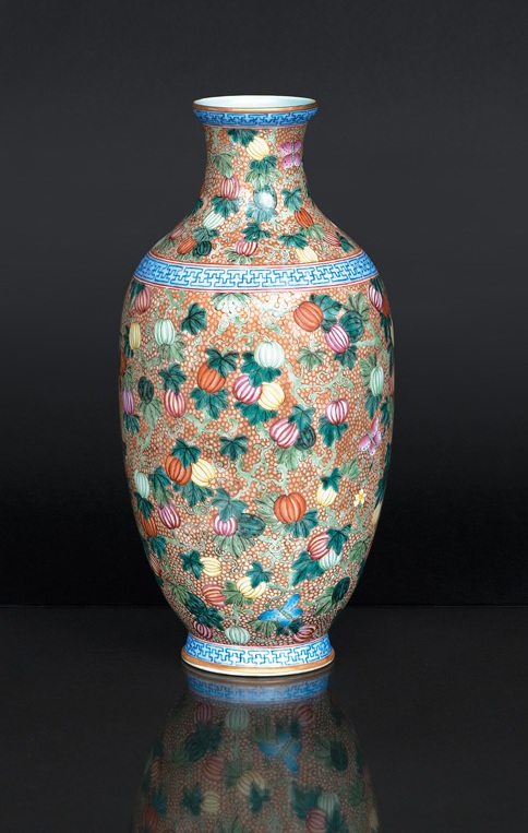 A magnificent baluster vase with melons and butterflies