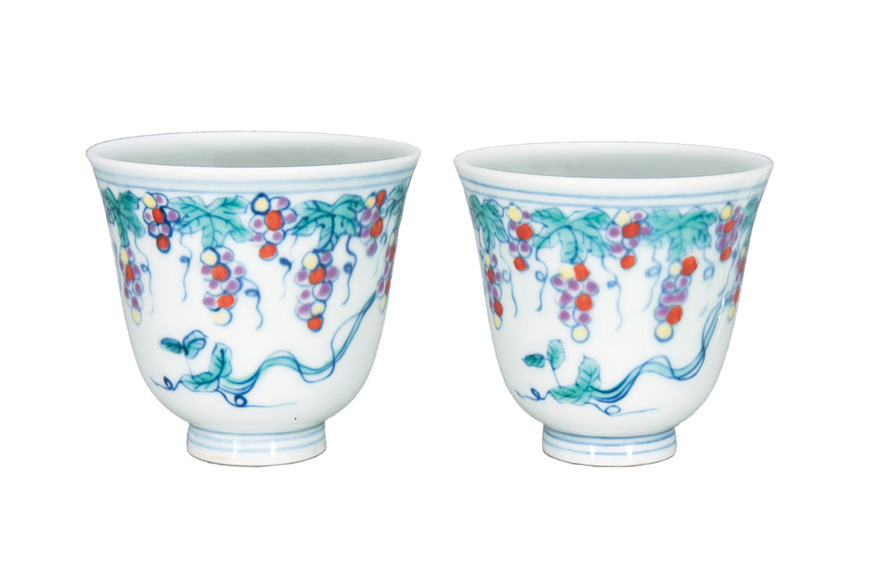 A pair of fine Doucai cups with grapevine