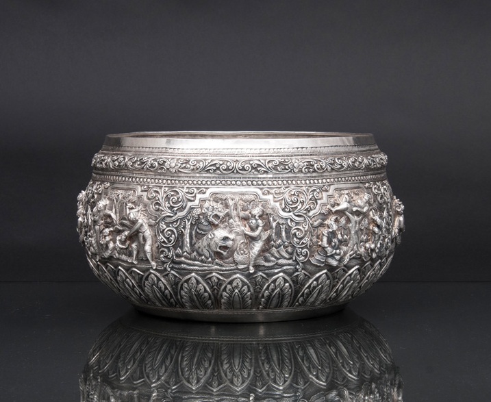 A large silver repoussé bowl with figural relief