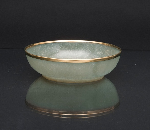 A fine jade bowl with gold rim